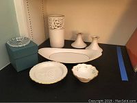 Photo of white ceramic vase, two candlesticks, oval bread tray, Sabbath dish, small bowl, and a box likely containing crystal coasters