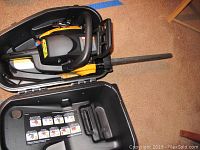 Poulan Pro chain saw in the open black plastic carrying case, showing the saw and case interior.