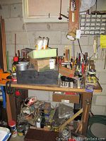 Overview of lot on bench showing toolbox, tools and supplies