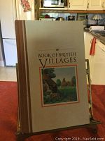 Photo of the book 'AA Book of British Villages' showing the front cover with title and a small illustration of a village.