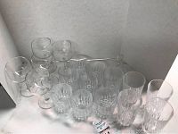Full lot display showing 5 wine glasses, 5 rock glasses, 5 tall glasses, and 1 bell in crystal glassware composition.