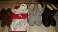 Four pairs of new ladies shoes size 9: brown boots, Red by Ecko white sneakers, grey UGG boots, and red sequin boots