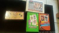 Four factory sealed NBA card sets from 1991-92 including Skybox, Hoops, Upper Deck, and USA Basketball Greatest Team set.