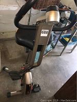 Side view of the MODE Exerpeutic bike showing the seat, pedals, and lower frame detail.
