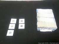 Overall view of tray containing many individually sleeved German coins, labeled 5 Pf 1874-1922
