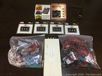 Full overhead view of all components including Control Master II, Synchro Sound Box box, five Atlas #205 connectors, and two bags with assorted wiring.