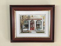 Front view of framed print showing the scene of 'The Niagara Apothecary' storefront with bicycle and autumn leaves.