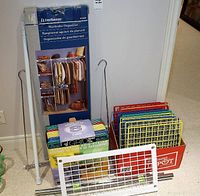 Photo showing the full set of metal wardrobe organizer components including the packaging, metal dowels, and colorful interlocking grid panels stacked inside a cardboard box.