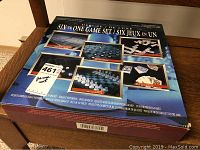 Box showing the deluxe six in one game set with pictures of each game included