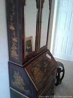 Front-right angle view of entire cabinet with drop-front closed and mirrored doors