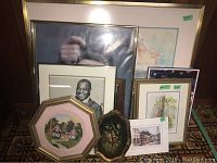 Overall view showing ten items including framed prints, small frameless print, and a decorative plate with floral design.
