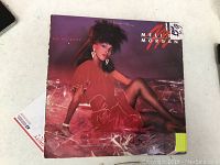 Front cover of Melisa Morgan 'Do Me Baby' album showing artist in red dress, minor edge wear, price sticker attached