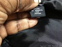 Photo of the vest tag showing style number 46586CXL indicating size medium-large.