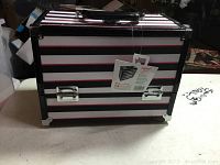 Caboodles Inspired Train Case closed, showing black, white, and pink horizontal stripes with metal corners and handle