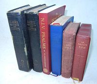 Photo of six vintage religious books standing upright showing titles and bindings