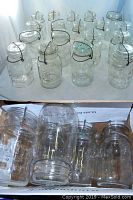 Rear view of the collection showing embossed brand names and different jar sizes in a box.