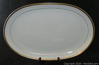 Full view of the 15-inch white oval serving platter with gold gilt edge