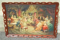 Full view of the framed print depicting 'Mozart at the Royal Court' with detailed carved wooden frame.