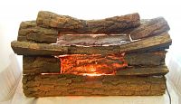 Front view showing realistic artificial wood logs with bark texture and orange light inside.