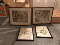 Four framed artworks: two larger oriental paintings with bamboo frames and two smaller framed bird prints with dark wood frames and linen mattes, displayed on a floor.