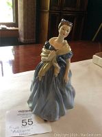 Front view of Royal Doulton Adrienne figurine showing full dress and figure details.