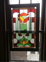 Frontal view of the stained glass hummingbird picture showing vibrant colors and design details.