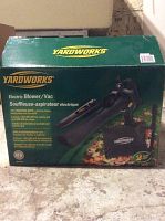 Box of Yardworks electric leaf blower/vac showing product image and branding.