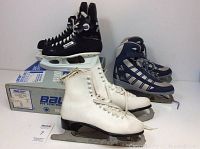 Three pairs of skates displayed: black Bauer hockey skates on original box, white figure skates, and navy Softec figure skates.