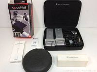 Altec Lansing portable speakers in case with cables, Zefal bike mount box, Head Rush Bluetooth speaker, Ethernet adapter box and cable