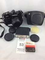 Full set of camera with case, lens caps, filters, mount adapter, and flash accessory