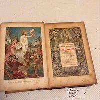 Open pages showing colored religious illustration and title page of the 1886 German Bible by P. Leonhard Goffine, published by Benzinger Brothers.
