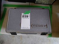 Closed Dremel branded hard plastic carrying case for rotary tool and accessories.
