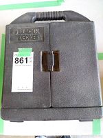 Closed Black & Decker branded plastic carrying case with handle.