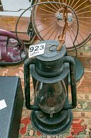 Front and top view of a vintage T. Wdicut & Co. No. 2 C.B. lantern with glass globe and black metal body, hanging string visible.