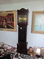Full view of Arthur Pegegnat grandfather clock showing hood, brass dial, trunk door and base