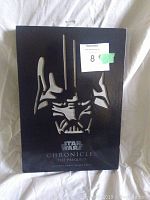 Front of the black slipcase with reflective silver Darth Vader mask cutout and Star Wars Chronicles The Prequels title.