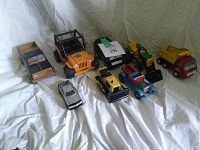 Full view of all 8 vintage Tonka toy trucks and cars