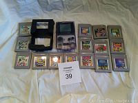 All items displayed: console, protector and cartridges.