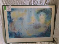 Full view of framed Peggy Hinaekian numbered print, showing the abstract female portrait in soft pastel colors.