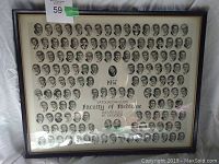 Full view of framed graduating class photo with many small oval portraits around a central portrait and text.
