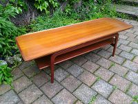 Front three-quarter view of full table showing top surface and lower shelf