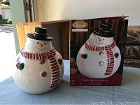Snowman cookie jar displayed outside, next to its original box which features the same snowman image and Gibson branding.