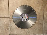 Front view of a 14-inch diamond blade showing labeling and segmented cutting edges.