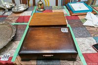 Wooden box containing the silver plated cutlery set, closed view.
