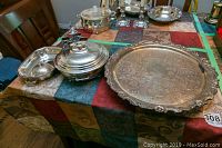 Photo showing all items including tray, bowl, platter, and egg cups on a colorful tablecloth.