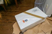 KeepsakePak white box with gold diagonal stripe containing the dress