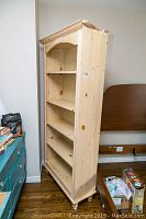 Full view of wooden bookcase showing structure and shelving