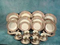 Full set of Mikasa Elegance gray china with dinner plates, luncheon plates, soup bowls, coffee/tea cups, and saucers arranged for display.