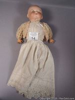 Full length front view of the ARMAND MARSEILLE Dream Baby Doll showing its dress and cardigan.