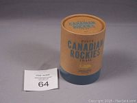 Photo of cylindrical cardboard packaging labeled Canadian Rockies Trail